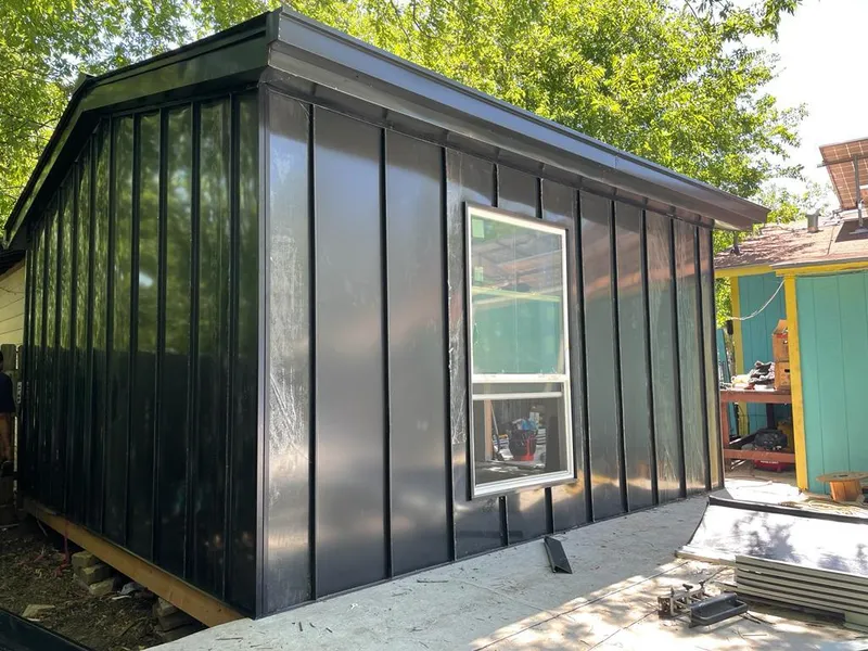 Black standing seam metal wall panels for Roof Inspection in Wyandotte